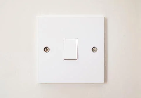 Light switch on a wall, UK Stock Photos