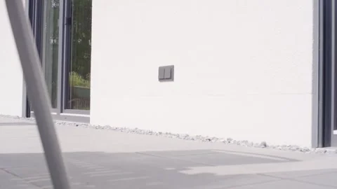 Light Switch on White Facade, Modern House Glass Doors, Static Wide Shot Stock-Footage 341572075