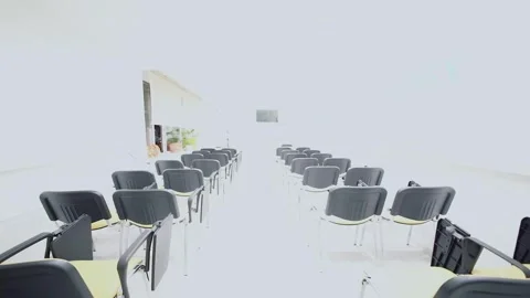 Light switched in classroom with many chairs in Cosmetology training center Stock Footage 276366845