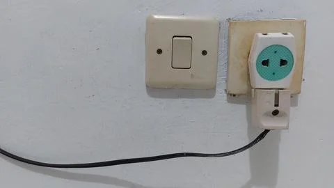 Light switches and electrical sockets in houses in Indonesia Stock Photos