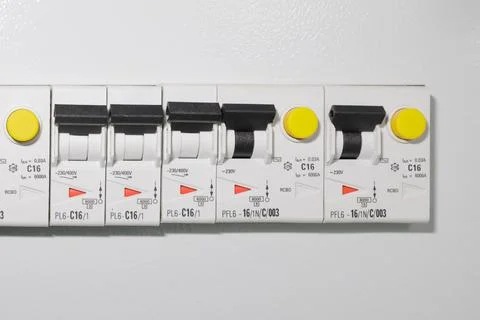 Light switches on a gray wall background in a house or hotel. Copy space. Stock Photos