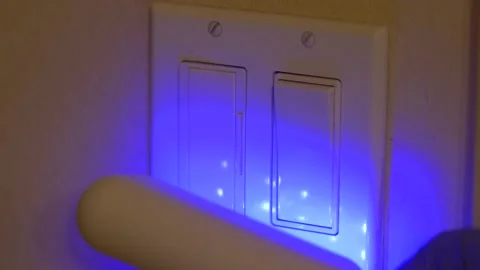 Light switches sterilized with UV C light used for coronavirus cleanup Stock Footage 131685319