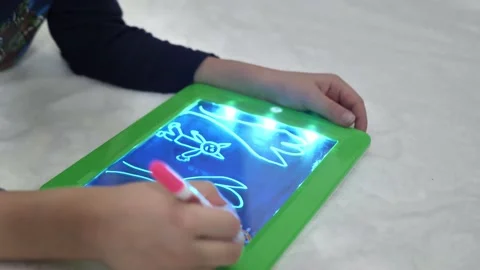 Light tablet for drawing, draws with a pen on a special tablet draws light. new Video stock 151285421