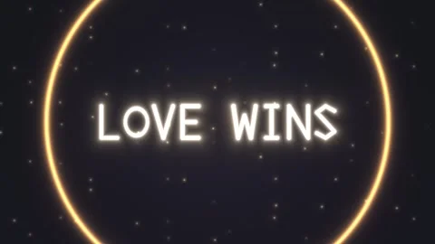Light text 'Love Wins' shines brightly against dark Stock Footage 339298342
