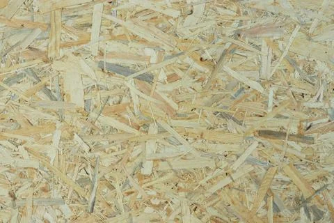 Light texture of pressed and varnished particleboard Stock Photos