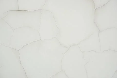 Light texture of thin neat cracks on the wall, similar to wallpaper. Stock Photos