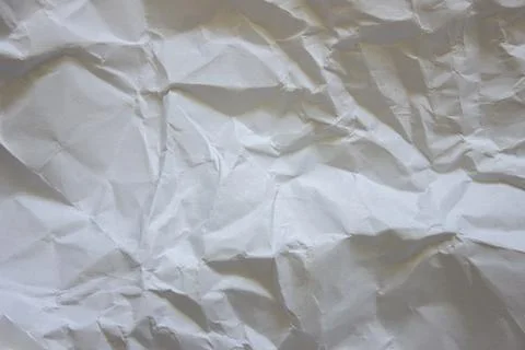 Light textured background. Texture of crumpled paper. Stock Photos