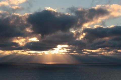 Light through clouds Stock Photos