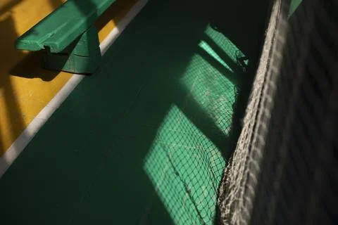 Light through grid. Light in gym. Shadow on floor. Stock Photos