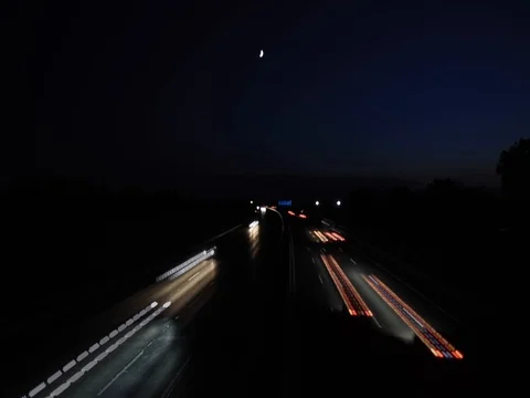 Light trace from busy night traffic on the highway Video stock 80367292
