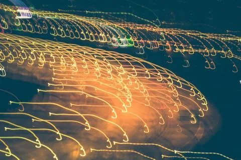 Light traces background. Lights trails dynamic backdrop. Night exposure motio Stock Photos