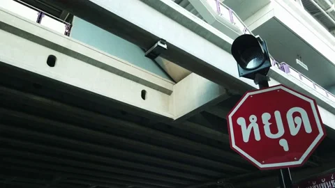 Light Traffic and Stop Sign (Translation Texts on the Sign is "STOP") Stock Footage 133983500