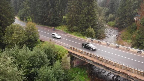Light Traffic on Bridge over River in Ukrainian Carpathian Mountains Stock-Footage 127860508