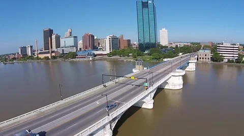 Light traffic crossing bridge over river into Toledo, Ohio Stock Footage 43736991