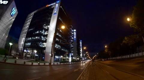 Light Traffic Late At Night In Front Of Business Center, Fish Eye, Pan Stock Footage 66460771