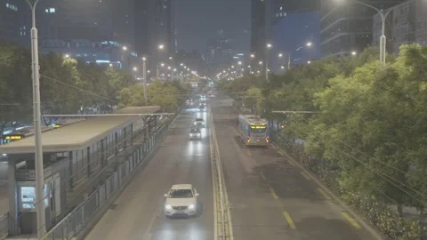 Light Traffic Moves Along Beijing Bus Lane at Night Stock Footage 340480537