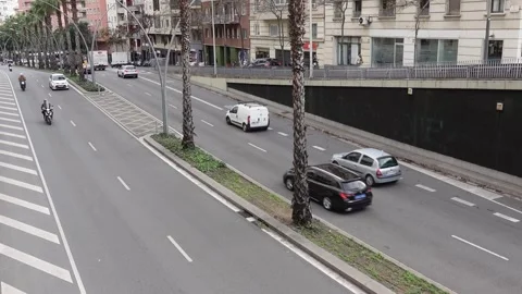 Light traffic on a road in Barcelona Video stock 295228847