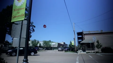 Light traffic at small town intersection Stock Footage 236707991
