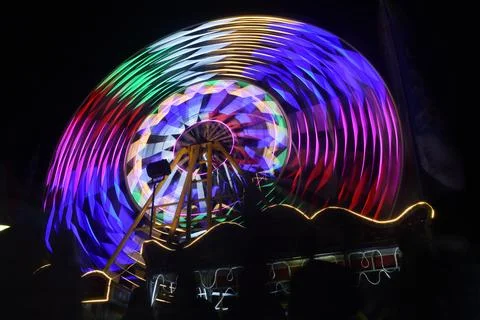 Light trails of Ferris wheel Stock Photos