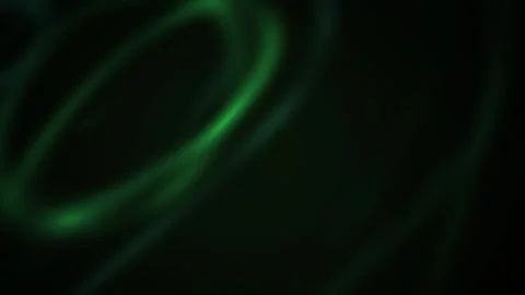 Light Trails Glow Green in Fast Swirls Across Dark Black Background as Abst.. Stock Footage 345368482