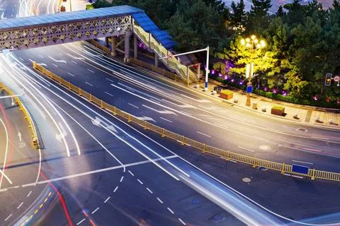 The light trails on the modern building background in shanghai china. the ... Stock Photos