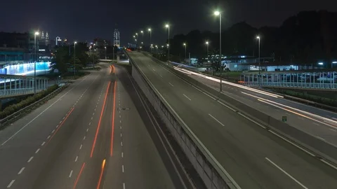 Light Trails Of Traffic On Freeway Leading Towards Kuala Lumpur Skyline Stock Footage 106657078