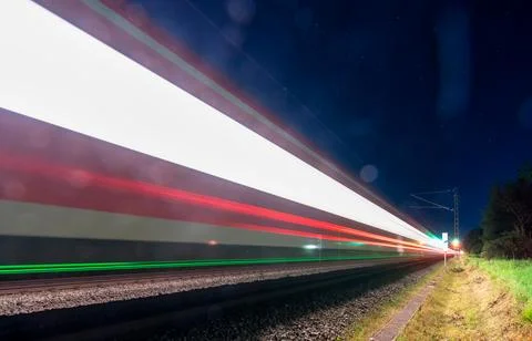 Light trails of a train, concept for high-speed under the stars Stock Photos