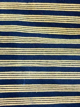 A light, translucent, open-grid textile with irregular dark fibers Stock Photos