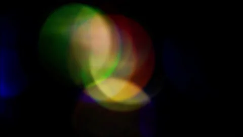 Light transmits bokeh of sparkling flickering lights. Soft colorful light leak Video stock 150935305