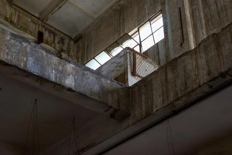 Light transmitted through the high windows of the patio of an abandoned old.. 스톡 사진