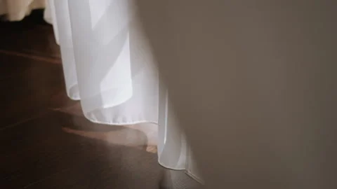 Light transparent white tulle sways slightly from the wind in the room Stock Footage 181146239