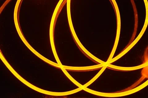Light transparent wire, cable, polyethylene tubes, rods of yellow lines. Stock Photos
