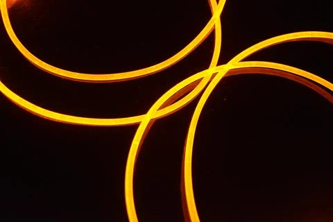 Light transparent wire, cable, polyethylene tubes, rods of yellow lines. Stock Photos