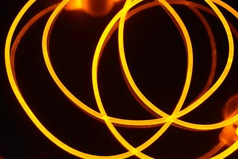 Light transparent wire, cable, polyethylene tubes, rods of yellow lines. Stock Photos