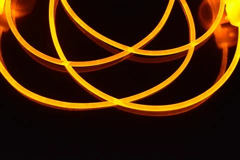 Light transparent wire, cable, polyethylene tubes, rods of yellow lines. 스톡 사진