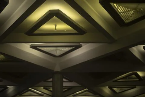 Light triangle. Lamp on ceiling. Light design. Architecture of 20th century. 스톡 사진