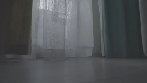 Light tulle with patterns hanging by curtain sways in wind Stock Footage 244914467