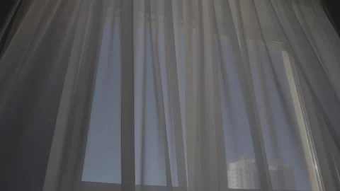 Light tulle on window moves from wind blow in premise of apartment Video stock 302224799