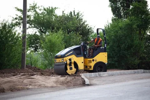 Light Vibration roller compactor at road construction and repairing asphalt p Stock Photos