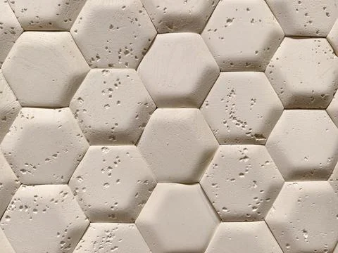 Light wall panels featuring hexagonal pattern imitation arranged in a const.. Stock Photos