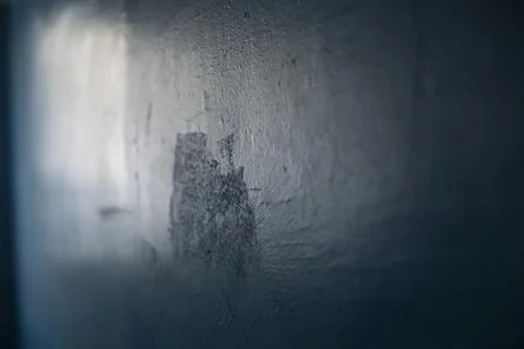 Light on wall. Wall surface. Blue paint. Stock Photos