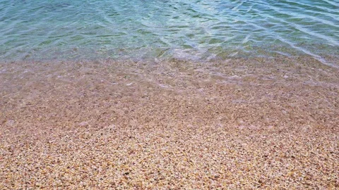 Light wave rolls on the sandy shore Video stock 105452194