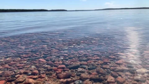 Light waves on the lake shore in slow motion Stock Footage 144476886