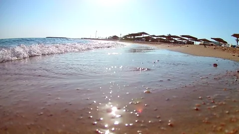 Light waves surf surf on the sandy shore on a clear sunny day, the Red Sea, a vi Stock Footage 114802017