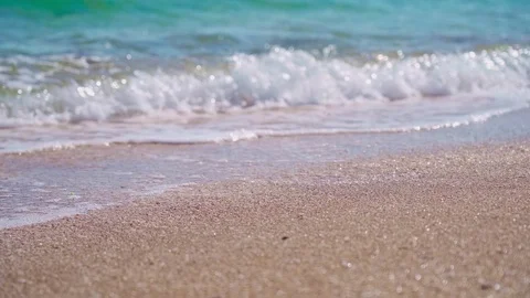 Light waves wash the amazing sandy beach Stock Footage 126786377