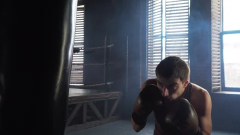 Light weight boxer training in vintage stylized gym Stock Footage 87834496