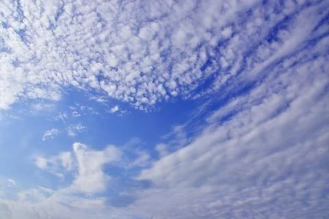 Light white clouds in the blue sky. Great background for graphic projects Stock Photos