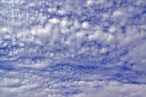 Light white clouds in the blue sky. Great background for graphic projects Stock Photos