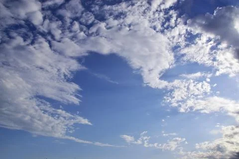 Light white clouds in the blue sky. Great background for graphic projects Stock Photos