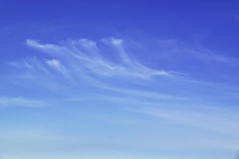 Light white clouds in the blue sky. Great background for graphic projects Stock Photos